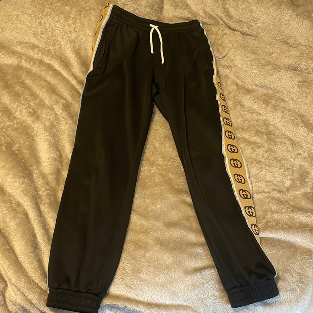Gucci black joggers. Size Small. Black with Gucci stripe and reflective.